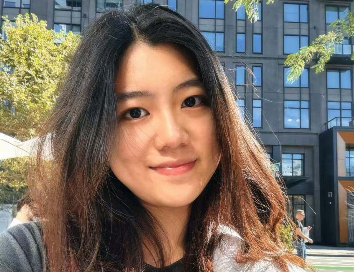 Photo of Ruyuan Li outdoors with tall building in the background